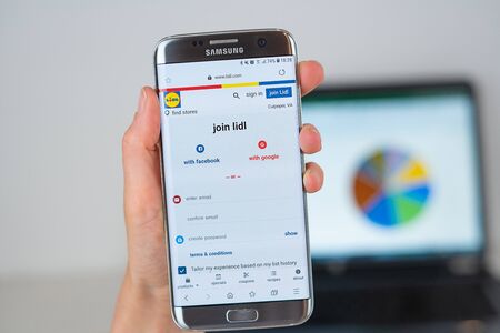 Barcelona / Spain 06 10 2019: Lidl web site on mobile phone screen. Mobile version of Lidl company web page on smartphone. Official web page of Lidl.のeditorial素材