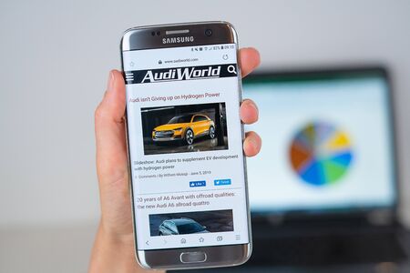 Barcelona / Spain 06 10 2019: AudiWorld web site on mobile phone screen. Mobile version of AudiWorld company web page on smartphone. Official web page of AudiWorld.のeditorial素材