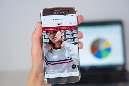 Barcelona / Spain 06 10 2019: Lacoste web site on mobile phone screen. Mobile version of Lacoste...