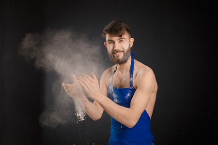 Young handyman or builder standing in the drive through in a hardware warehouse with a tablet in his hand looking at the cameraの写真素材