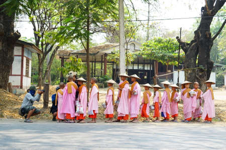People activities in morning at traditional fresh market, street vendors and buyer of fresh fish, meat and vegetable. Local people in bustling morning market in Myanmar.のeditorial素材