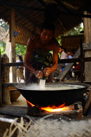 People activities in morning at traditional fresh market, street vendors and buyer of fresh fish, meat and vegetable. Local people in bustling morning market in Myanmar.のeditorial素材