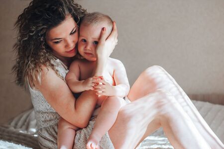 mother hug baby boyの写真素材