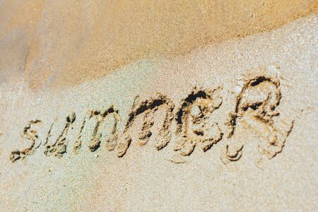 word summer on sand near riverの写真素材