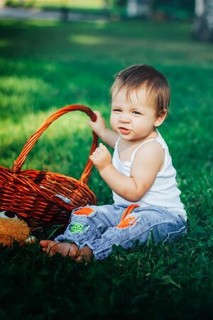 Quite extraordinary funny portrait of baby holding basketの写真素材