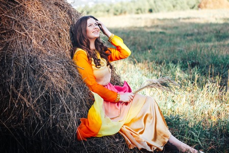 beautiful girl portrait on hayの写真素材