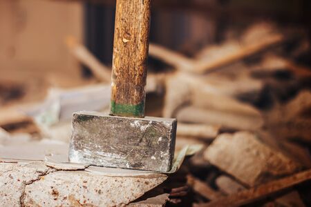 old sledge hammer on ruins in flat for broken wallの写真素材