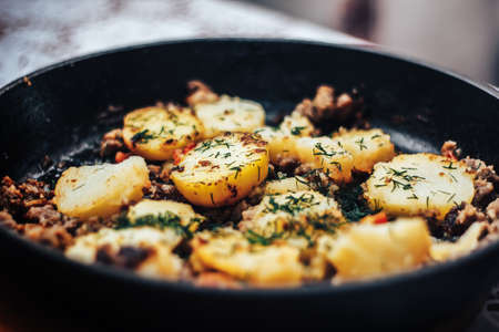 Moroccan food: forcemeat baked with fennel and potatoes close-up on a plate. horizontal view from aboveの写真素材
