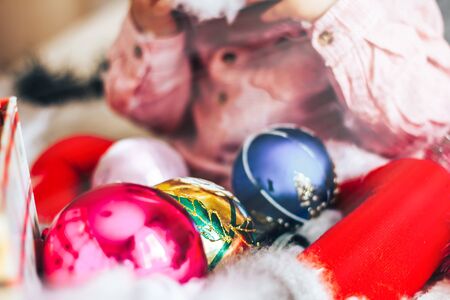 christmas tree decorattions lie near the babyの写真素材