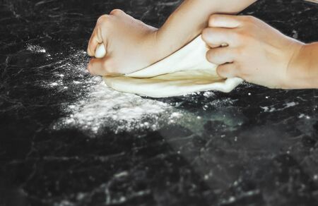 Making dough by female hands at home