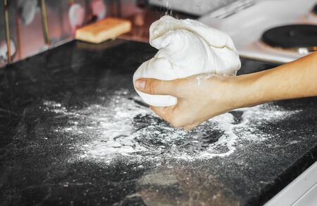 Making dough by female hands at home