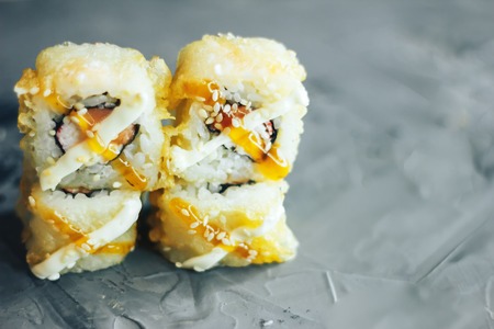 Salmon Fried Maki Sushi - Hot Roll with Cream Cheese and Cucumber inside. Deep Fried Salmon outside.の写真素材