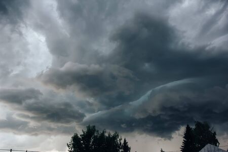 Background of storm clouds before a thunder-storm, lighteningの写真素材