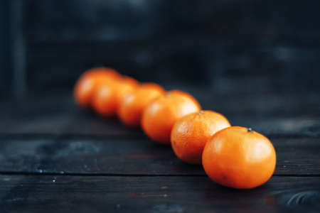 Mandarins lie on table lined upの写真素材