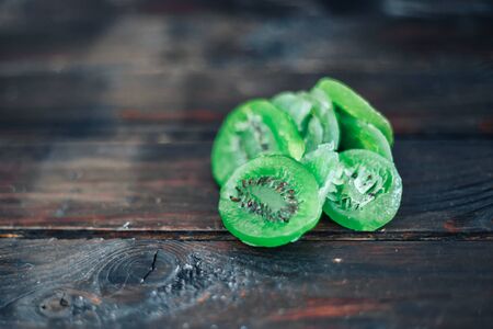 slices of dried kiwi on the wooden backgroundの写真素材