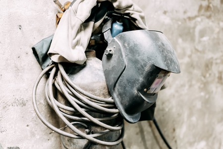 dirty old Welding mask, welding machine indoor