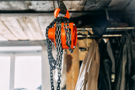 Metal chains hanging from the ceiling with reducer