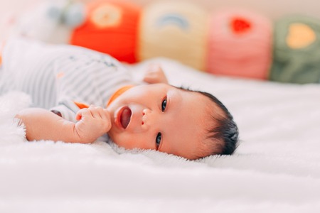 Closeup Portrait Of Newborn Baby girl Looking At The Cameraの写真素材