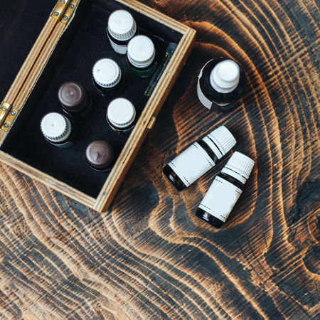 Glass bottles with different scents and exotic types of essential oils.の写真素材