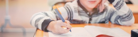 soft focus.high school or university student holding pencil writing on paper answer sheet.sitting on...
