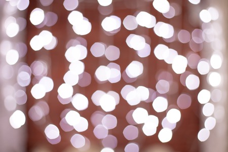 Christmas garlands with white decoration on holiday background with bokehの写真素材