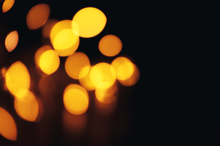 Christmas background. Festive abstract background with bokeh defocused lights and starsの写真素材