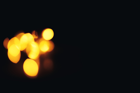 Christmas background. Festive abstract background with bokeh defocused lights and starsの写真素材