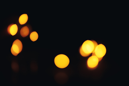 Christmas background. Festive abstract background with bokeh defocused lights and starsの写真素材