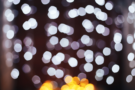 Christmas garlands with white decoration on holiday background with bokehの写真素材