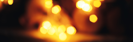 Defocus of the colorful Bokeh background, Yellow bokeh from many gerland decorated long bannerの写真素材