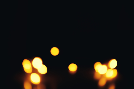 Christmas background. Festive abstract background with bokeh defocused lights and starsの写真素材