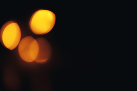 Christmas background. Festive abstract background with bokeh defocused lights and starsの写真素材