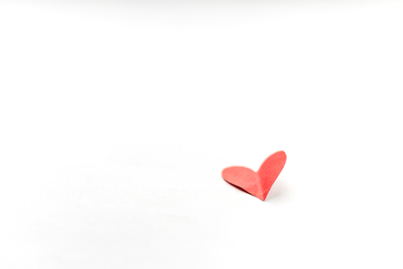 Red heart paper on white background minimalismの写真素材