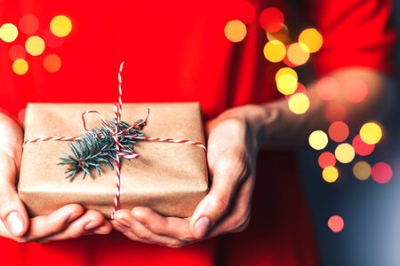 Woman holding christmas gift.の写真素材
