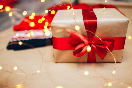 Red holiday scarf and christmas gift selected focus.の写真素材