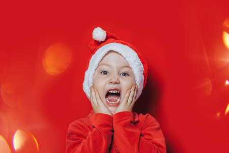 Small boy in Santa suitの写真素材