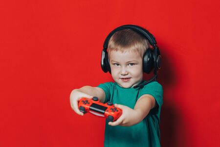 Small boy playing video gameの写真素材