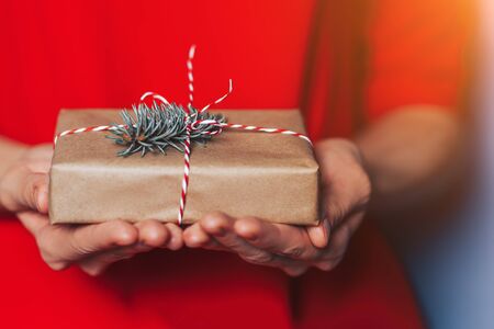 Woman holding christmas gift.の写真素材