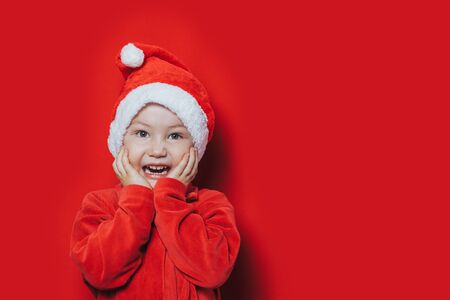 Small boy in Santa suitの写真素材