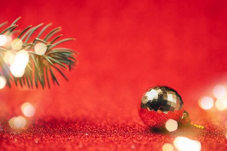 Yellow disco ball on red background close up.の写真素材