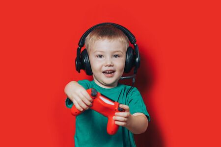 Small boy playing video gameの写真素材