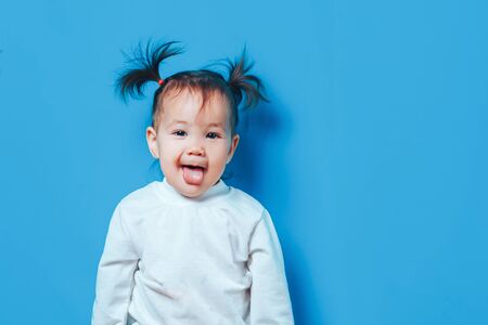 Little girl show tongueの写真素材