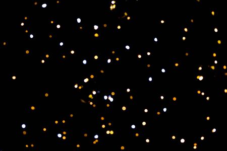 glitter lights on black backgroundの写真素材