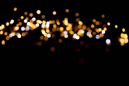 glitter lights on black backgroundの写真素材