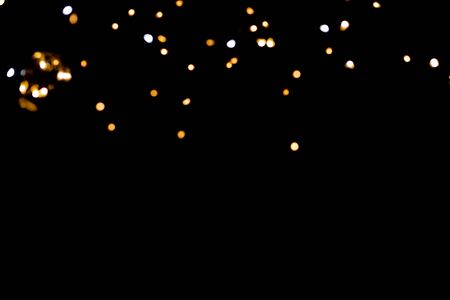 glitter lights on black backgroundの写真素材