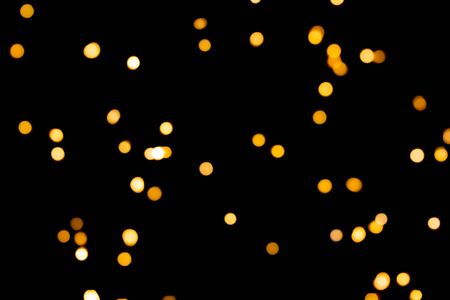 glitter lights on black backgroundの写真素材