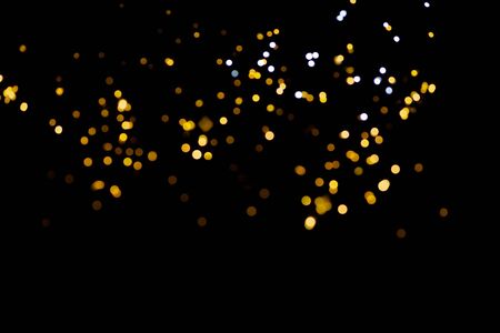 glitter lights on black backgroundの写真素材