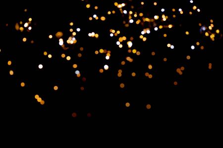 glitter lights on black backgroundの写真素材