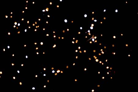glitter lights on black backgroundの写真素材