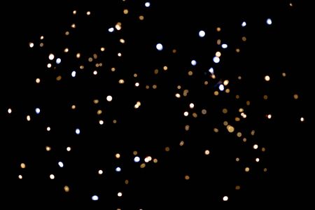 glitter lights on black backgroundの写真素材